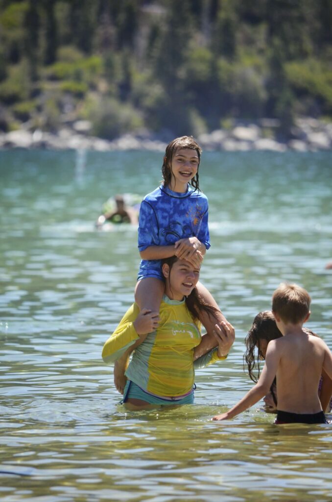 Lake Tahoe kids playing chicken in the lake